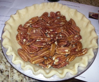 Spread the pecans along the bottom of the pie crust.