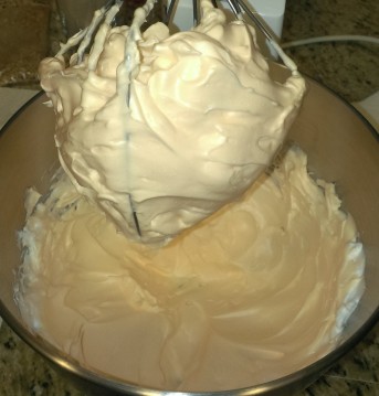 Whip the egg white mixture into firm peaks.